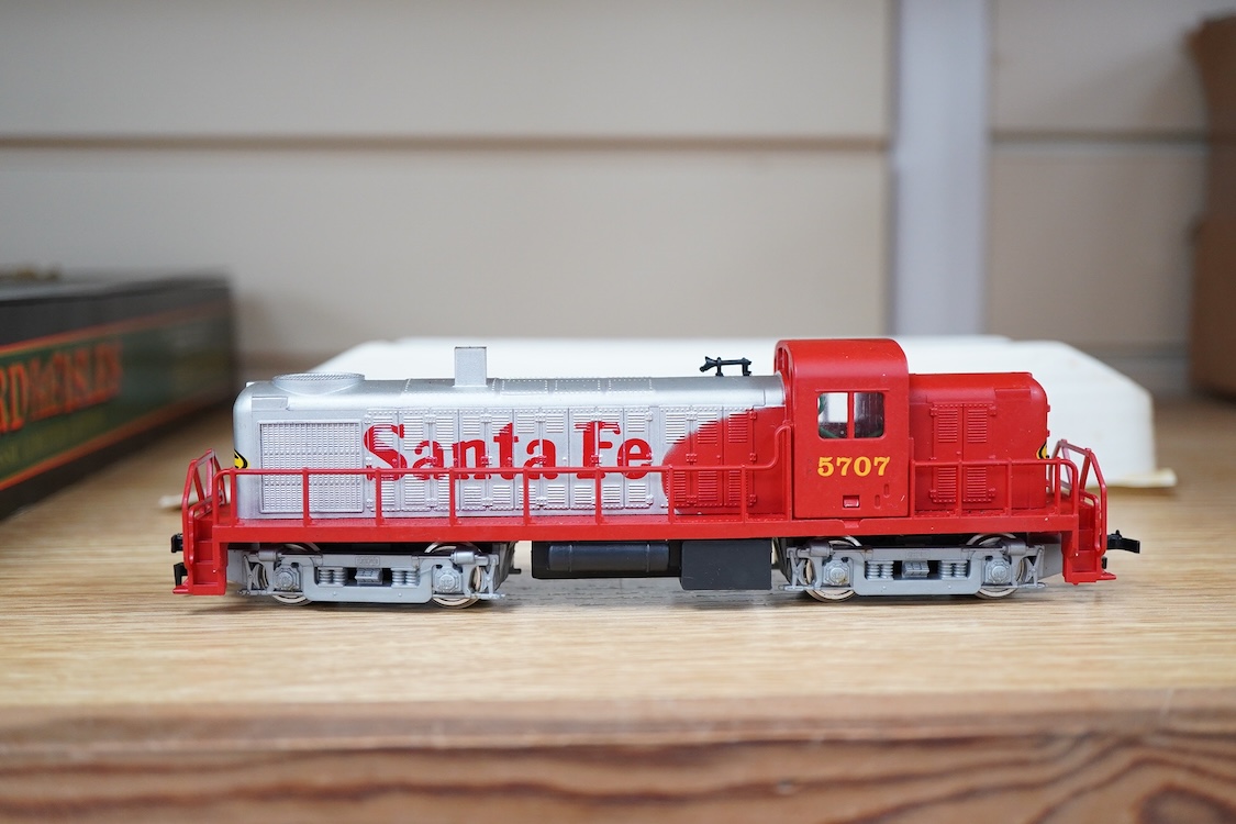 A quantity of US outline HO railway by Athearn, Bachmann, etc. including three locomotives; a Union Pacific Bo-Bo diesel, 1468, a Santa Fe Bo-Bo diesel, 5707, and a Santa Fe 0-4-0 tender engine, together with a 12-wheel